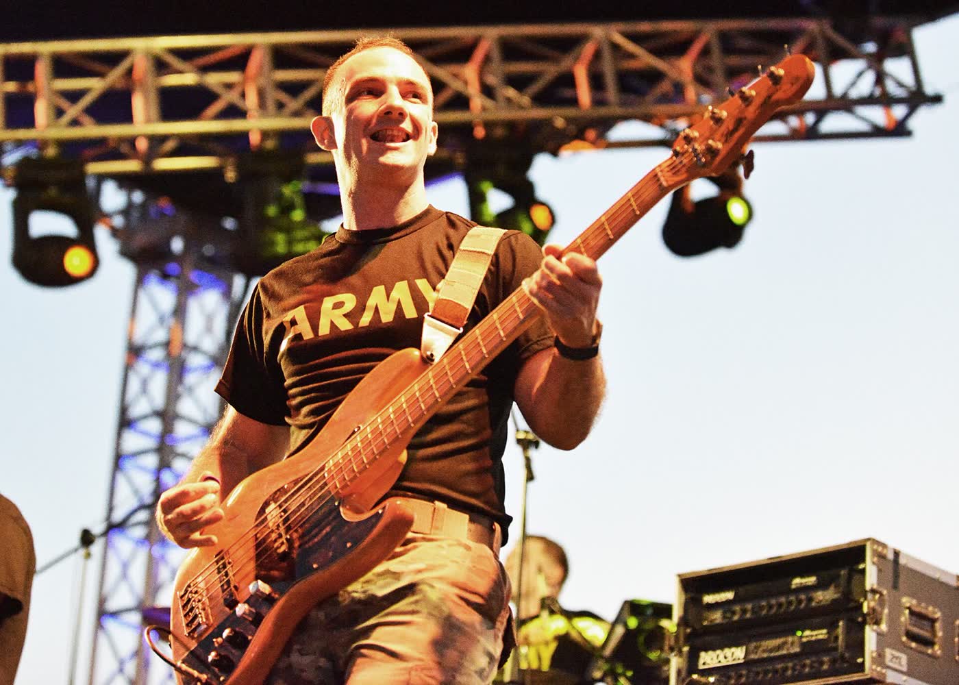 A Veteran bassist on stage under the rig lights